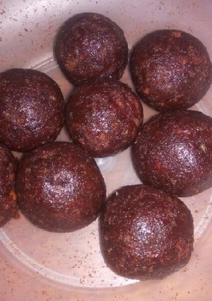A picture of Red jam and cake crumbs balls.