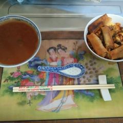 A picture of Japanese spicy salami sticks with roll up scrambled eggs.