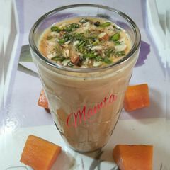 A picture of Papaya lassi with jaggery.