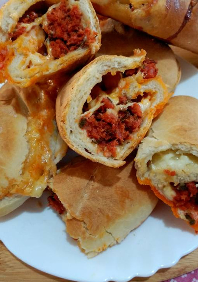 Una foto de Panecillos de pan preñao en horno de leña