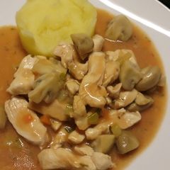 Chicken in a white wine and tarragon sauce A picture of Chicken in a white wine and tarragon sauce.