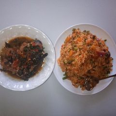 A picture of Vegetable jallof rice with catfish peppersoup.