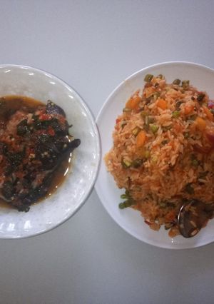 A picture of Vegetable jallof rice with catfish peppersoup.