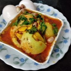 A picture of Egg Curry in peanuts khus khus gravy.