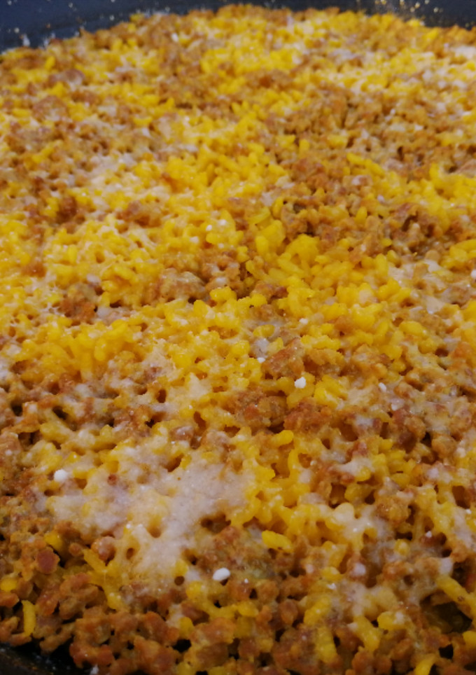 Una foto de Arroz de magro y parmesano
