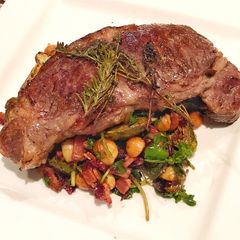 Sirloin steak with Balsamic glazed brussels sprouts with bacon, cranberry, walnut and blue cheese A picture of Sirloin steak with Balsamic glazed brussels sprouts with bacon, cranberry, walnut and blue cheese.