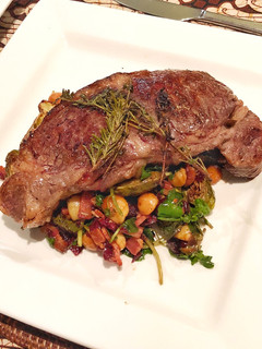 A picture of Sirloin steak with Balsamic glazed brussels sprouts with bacon, cranberry, walnut and blue cheese.