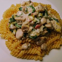 A picture of Pasta with chicken in cream cheese.