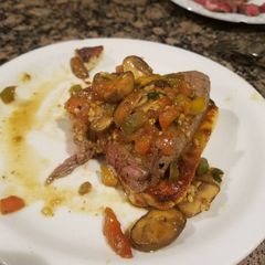 A picture of Steak pizzaoli.