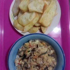A picture of Egg and fish sauces with fried sweet potatoes.
