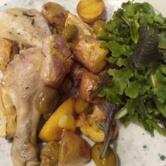 A picture of Greek baked chicken and potatoes.
