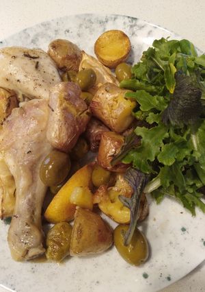 A picture of Greek baked chicken and potatoes.