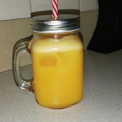 A picture of Freshly squeezed orange and ginger juice.