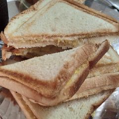 A picture of Egg chicken sandwich with YUMMy Tea.