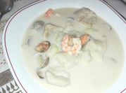 Una foto de merluza cocida con mayonesa