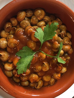 Una foto de Caracoles chupaeros con tomate