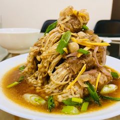 A picture of Enoki wrapped in beef.