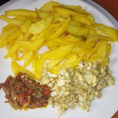A picture of Fried chips with egg and sauce #KADUNACOOKOUT.