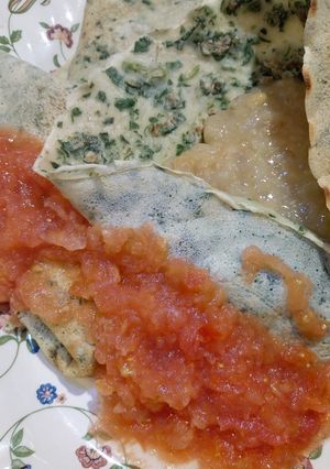 Una foto de Crepes de espinacas rellenos con crema de choclo