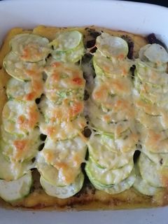 Une photo de Polenta provençale aux courgettes