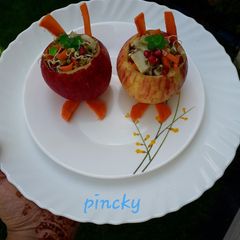 A picture of Apple stuffed with sprout &fruits kid's special.