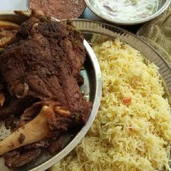 A picture of Mutton Leg (bakray ki Raan) on stove.