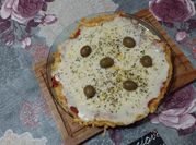 Una foto de condimentos para pizza