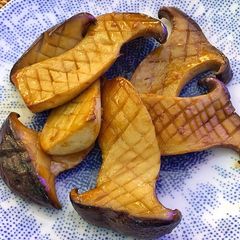 A picture of King oyster mushrooms sautéed in soy butter.