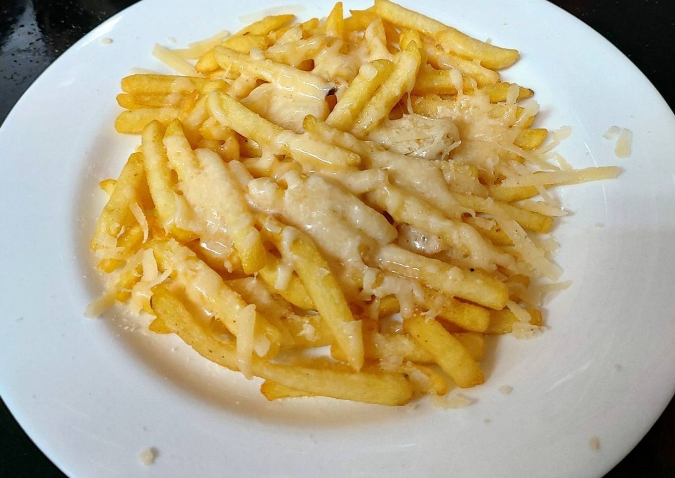 My Parmesan melted Cheese over French fries ðŸ˜˜