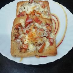 A picture of Tomato Bruschetta on a Tawa.