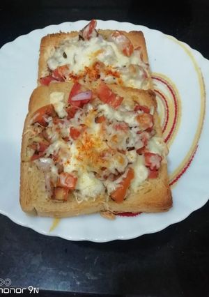 A picture of Tomato Bruschetta on a Tawa.