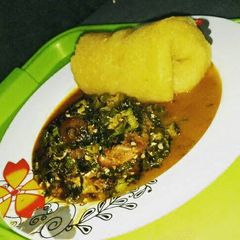 A picture of Watery Okro soup garnished with prawn, pomo, stock fish and beef.
