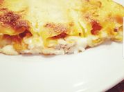 Una foto di cannelloni alla salsiccia