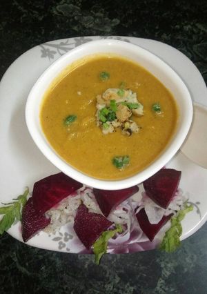 A picture of Moong daal soup with roasted cauliflower.
