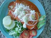 Una foto de enchiladas de jitomate
