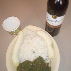 A picture of White rice with vegetable sauce and banana.