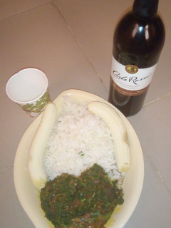 A picture of White rice with vegetable sauce and banana.
