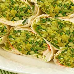 A picture of Stir fried Cabbage, green peas, bok choy stuffed Pita bread.