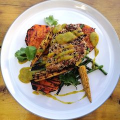 A picture of Sesame crusted tuna, grilled veg/mango,lime and coriander sauce.