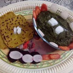 A picture of Sarso Ka saag with makki ki roti.
