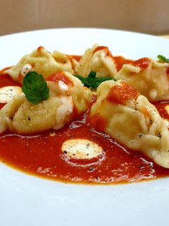 Foto di Culurgiones d'Ogliastra al sugo e fonduta di parmigiano