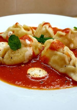 Foto di Culurgiones d'Ogliastra al sugo e fonduta di parmigiano