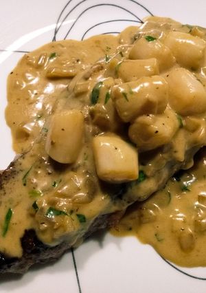 A picture of Steak, scallops, and cream.