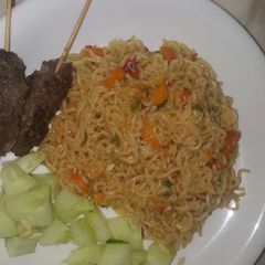 A picture of Veggie noodles with minced beef sticks.