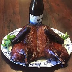 A picture of California Farm Tea Smoked Whole Duck.