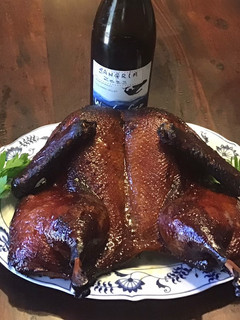 A picture of California Farm Tea Smoked Whole Duck.