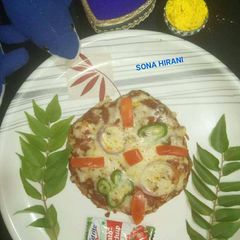 A picture of Green moong pizza.
