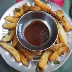 A picture of Potato wedges.