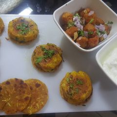 A picture of Bottle gourd (lauki) Paratha with fried soya chunks and aloo tikki.