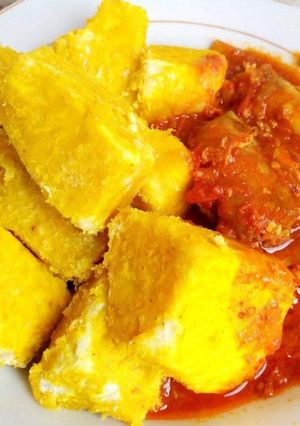 A picture of Yam and palmoil sauce.